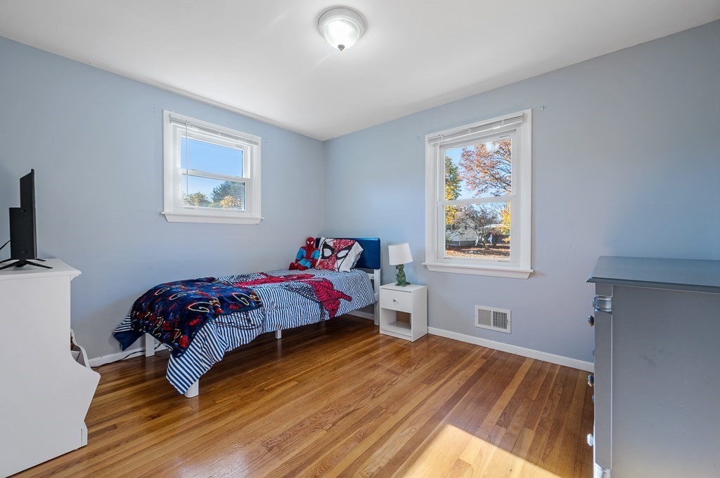 104 Conrad Road Marlborough, MA 01752 - Photo 15 of 34 a bedroom with a bed and a window