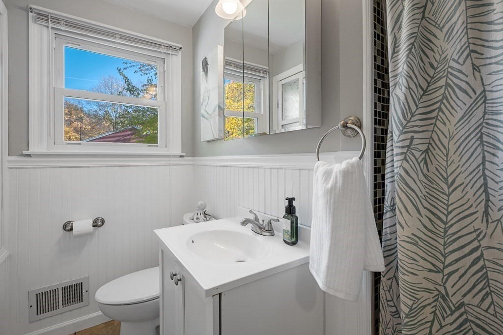 104 Conrad Road Marlborough, MA 01752 - Photo 18 of 34 a bathroom with a sink a toilet and a mirror