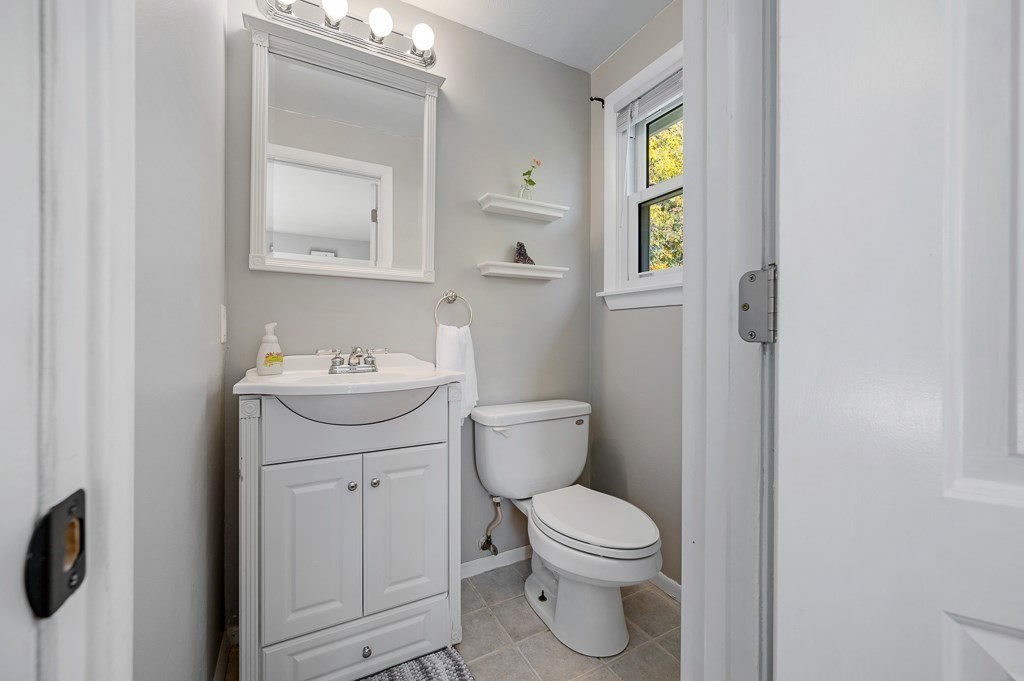 104 Conrad Road Marlborough, MA 01752 - Photo 21 of 34 a bathroom with a toilet sink and mirror