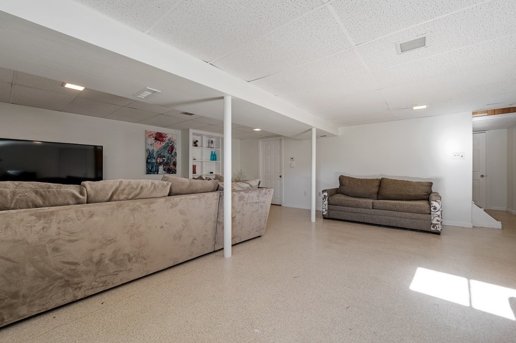 104 Conrad Road Marlborough, MA 01752 - Photo 24 of 34 a living room with furniture and a couch