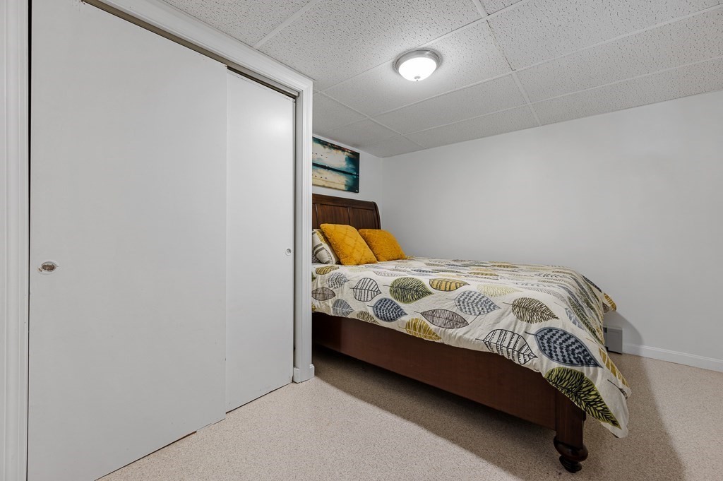 104 Conrad Road Marlborough, MA 01752 - Photo 25 of 34 a bedroom with a bed and a window