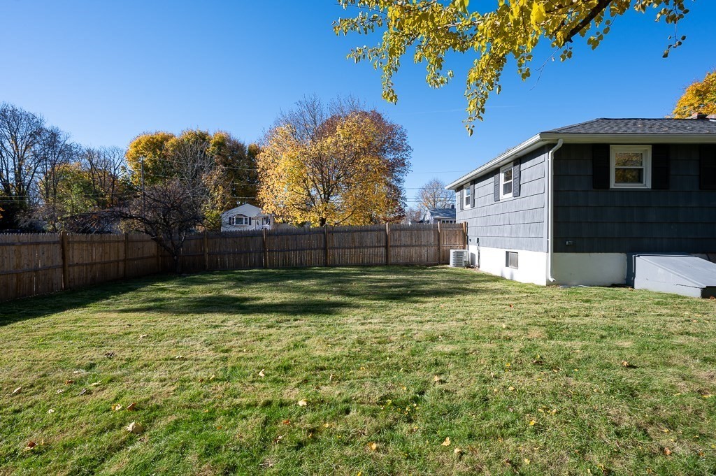 104 Conrad Road Marlborough, MA 01752 - Photo 30 of 34 a backyard of a house with lots of green space