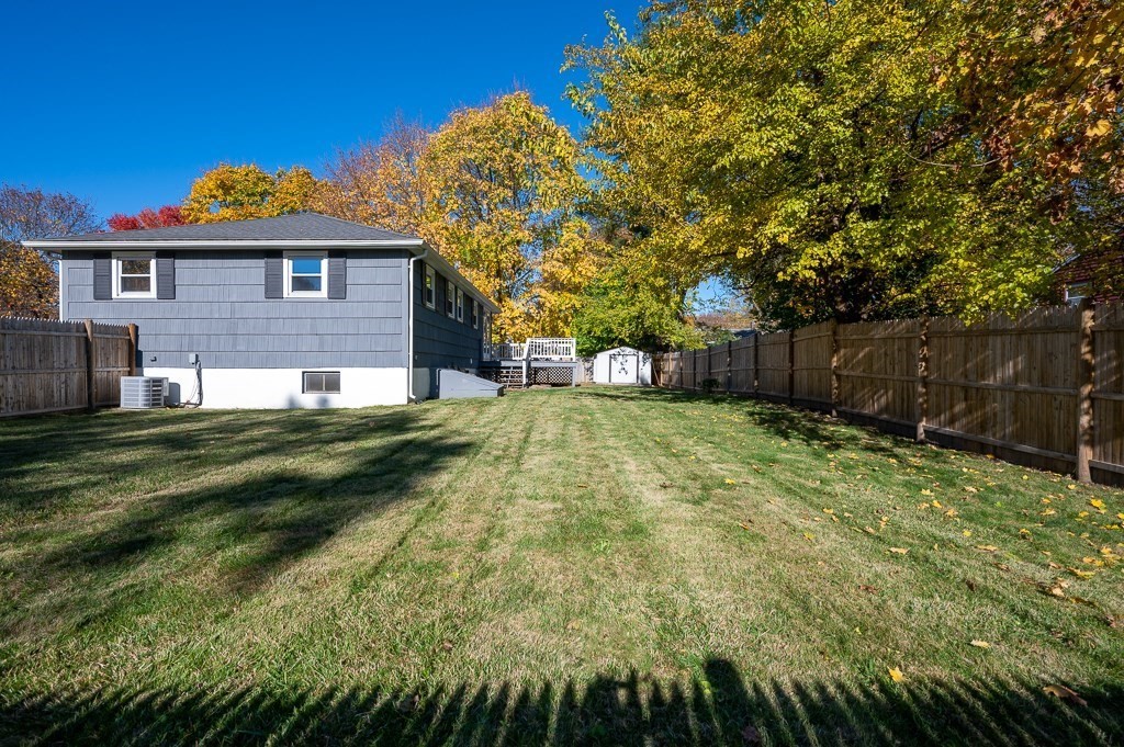 104 Conrad Road Marlborough, MA 01752 - Photo 31 of 34 a view of a yard in front of a house with a large tree