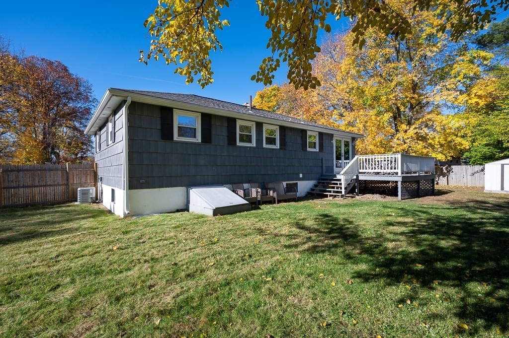 104 Conrad Road Marlborough, MA 01752 - Photo 32 of 34 a front view of a house with a garden