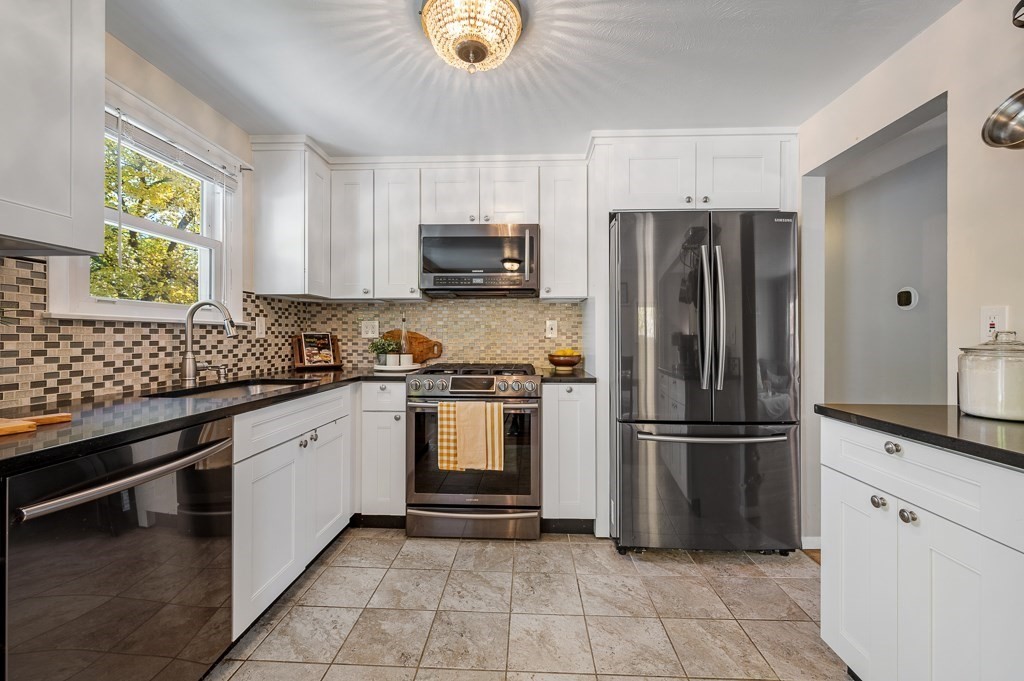 104 Conrad Road Marlborough, MA 01752 - Photo 9 of 34 a kitchen with stainless steel appliances granite countertop a refrigerator sink and microwave