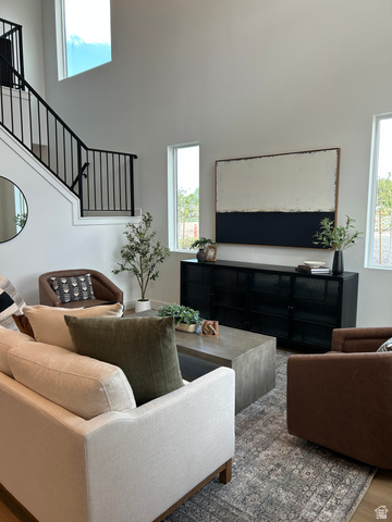 2011 West 1150 South, Unit 1042 Payson, UT 84651 - Photo 21 of 39 Photos are of model home.Two-story living area featuring high ceilings, contemporary black metal stair railing, and tall, narrow windows