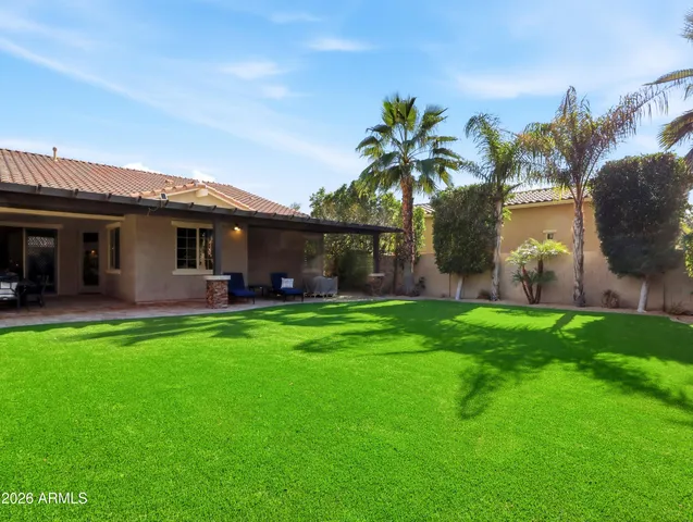 an aerial view of multiple houses with yard
