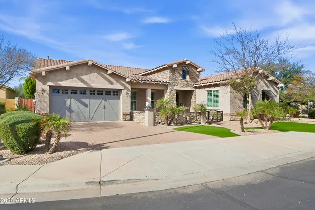 a view of a dining room with furniture wooden floor and chandelier