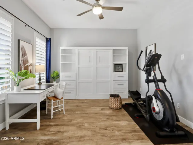 a view of a dining room with furniture wooden floor and chandelier