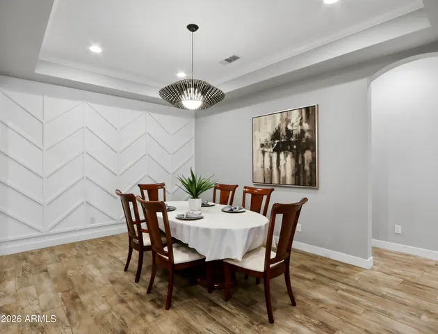 a bedroom with a large bed and a flat screen tv