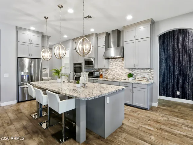 a bathroom with a sink mirror and toilet