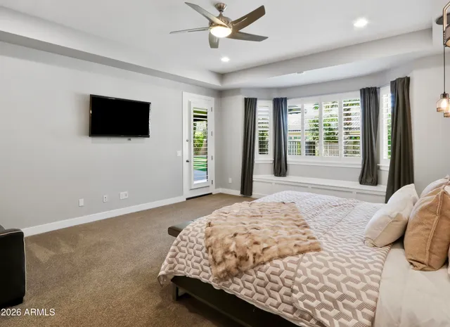 a view of a house with backyard porch and sitting area