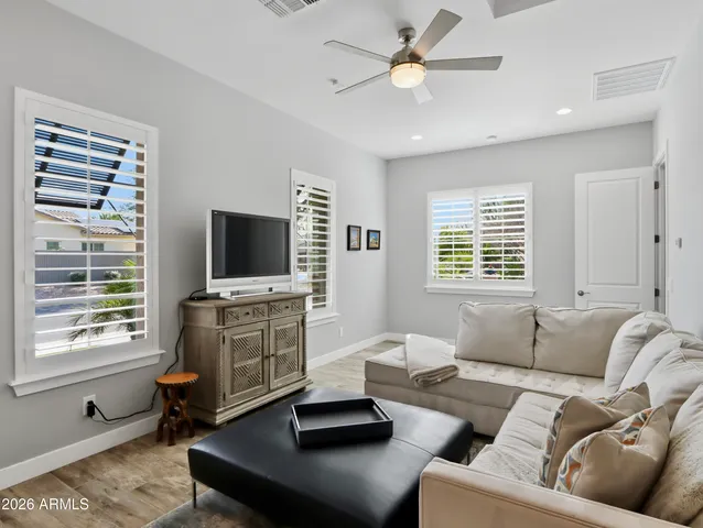 an aerial view of a house with a yard and potted plants