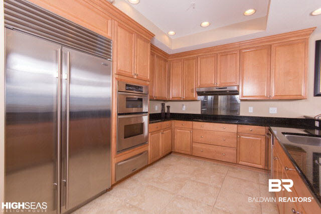 28250 Canal Road, Unit 906 Orange Beach, AL 36561 - Photo 10 of 43 Granite countertops, stainless steel appliances, most cabinets have pull-outs in them.