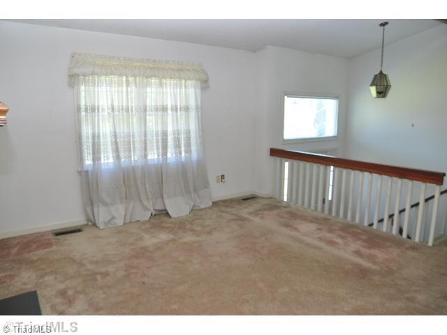 7012 Harperglen Road Clemmons, NC 27012 - Photo 3 of 16 Living Room. The living room overlooks the two story foyer.