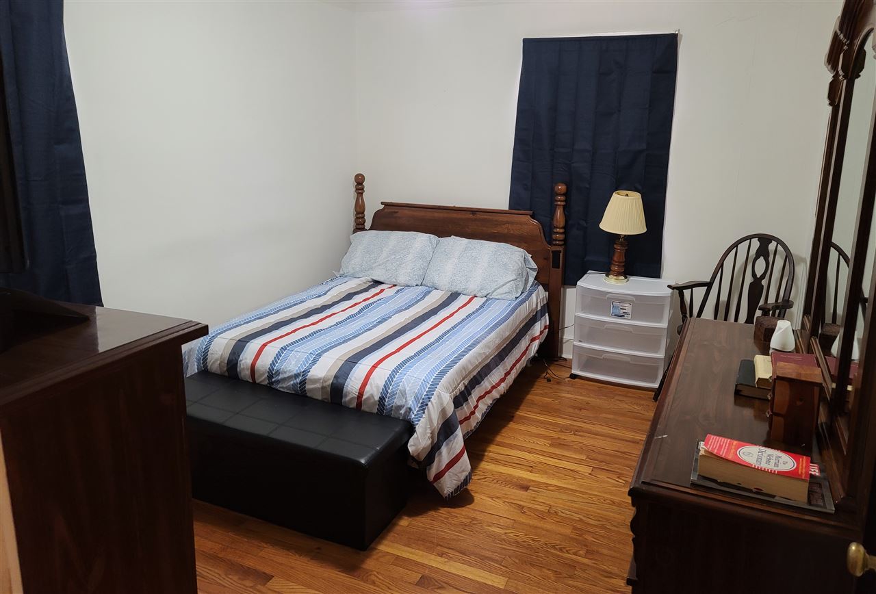 3732 Healey Road Memphis, TN 38111 - Photo 4 of 11 a bedroom with bed and wooden floor
