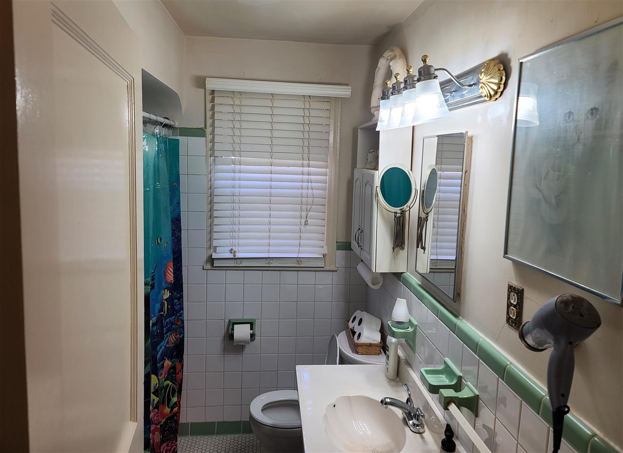 3732 Healey Road Memphis, TN 38111 - Photo 6 of 11 a bathroom with a sink mirror and toilet