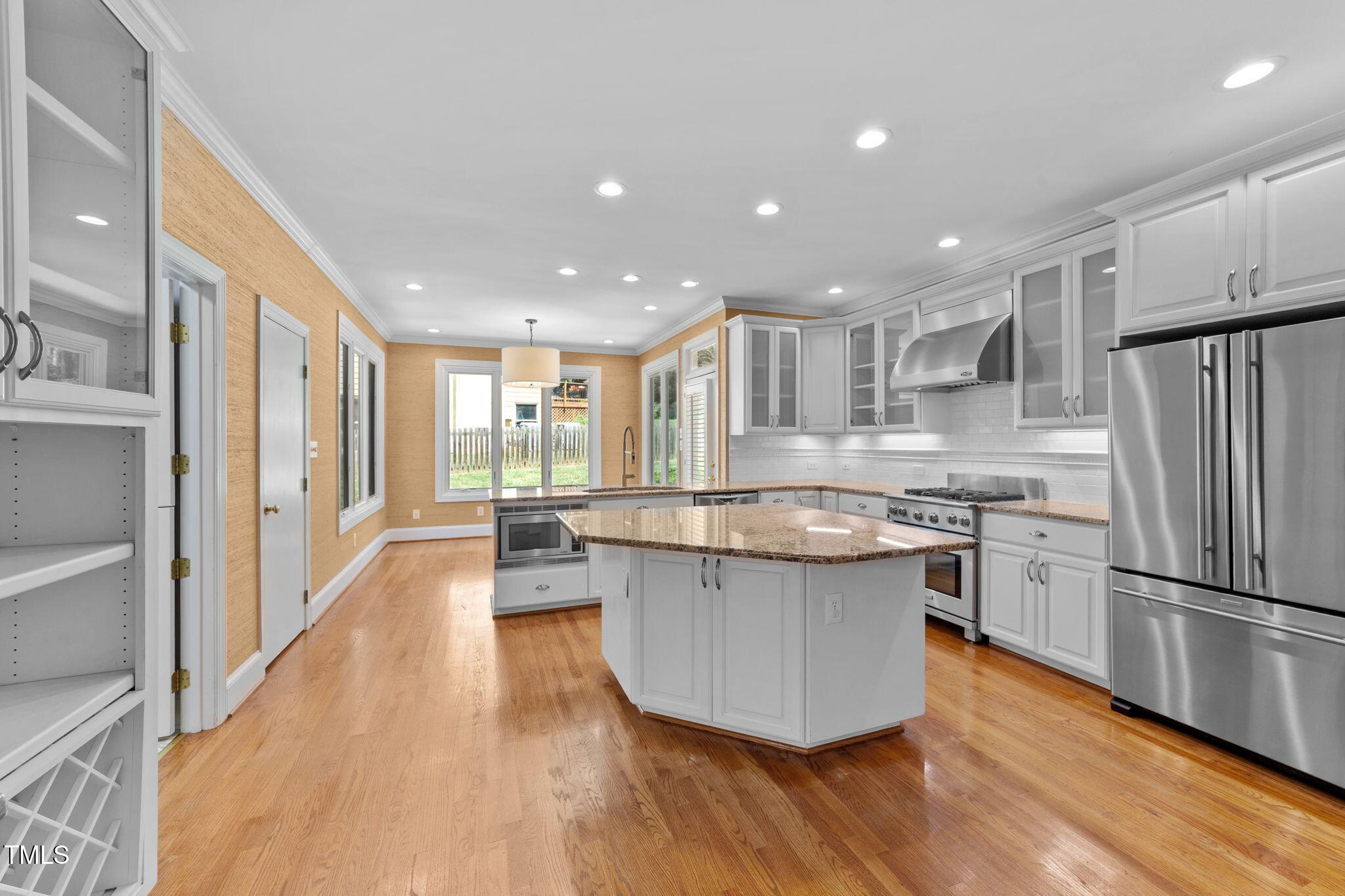 2613 Hawtree Drive Raleigh, NC 27613 - Photo 10 of 47 a kitchen with stainless steel appliances granite countertop a refrigerator a sink dishwasher a stove and a refrigerator with wooden floor