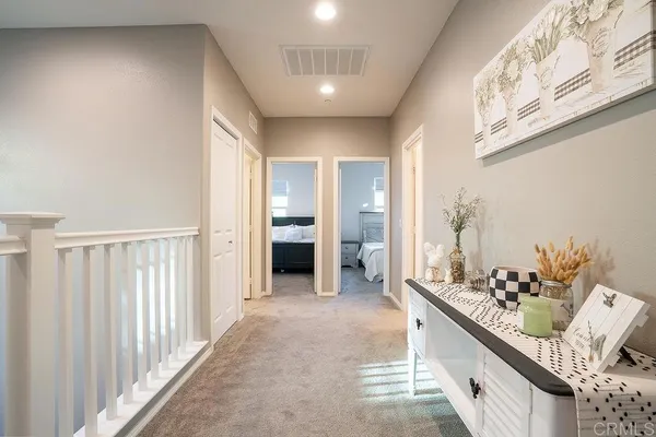 a view of a hallway view with staircase