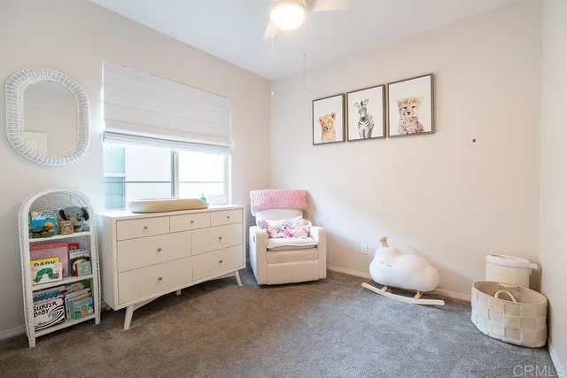 a room with toys and dresser