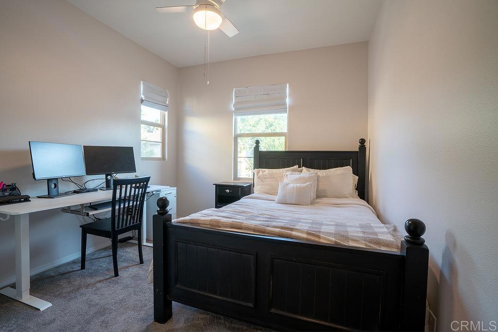 1132 Cherry Tree Lane Vista, CA 92084 - Photo 26 of 39 a bedroom with a bed and a desk