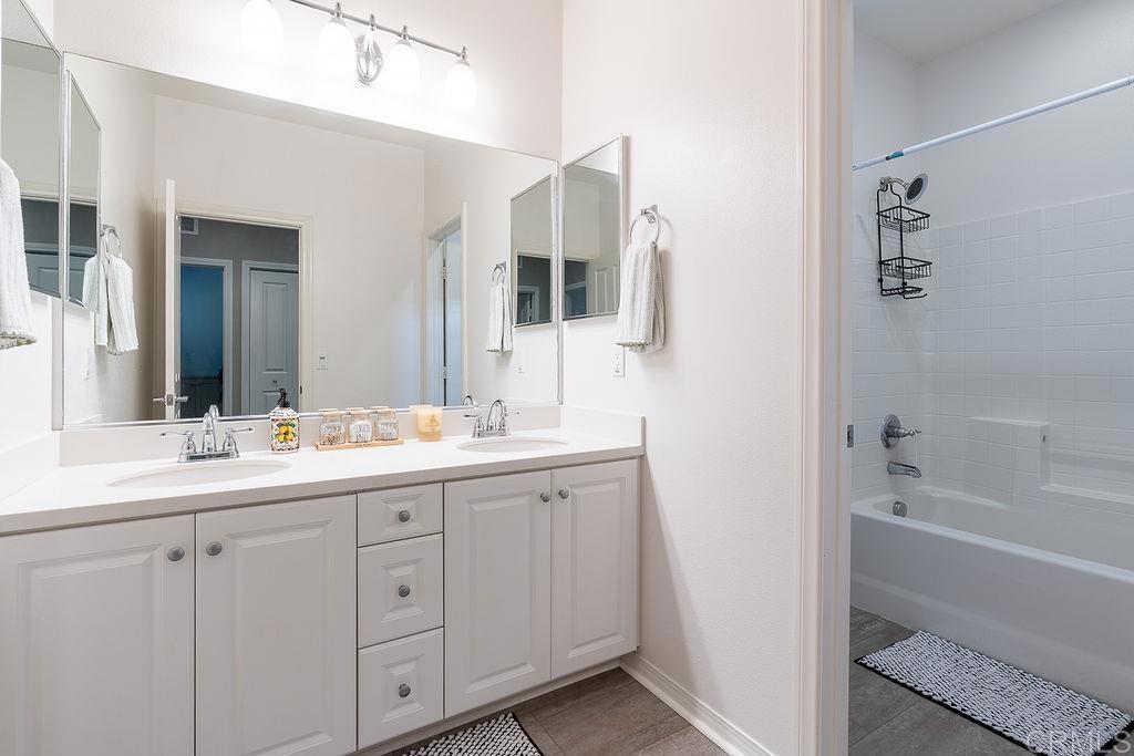 1132 Cherry Tree Lane Vista, CA 92084 - Photo 27 of 39 a bathroom with a double vanity sink mirror and bathtub
