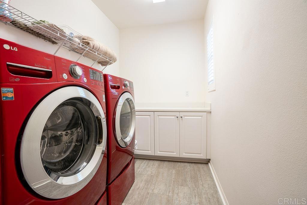 1132 Cherry Tree Lane Vista, CA 92084 - Photo 28 of 39 a utility room with dryer and washer