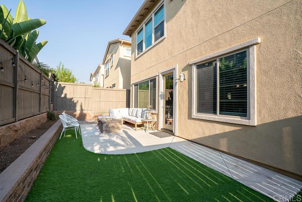1132 Cherry Tree Lane Vista, CA 92084 - Photo 30 of 39 a view of a chair and table in backyard of the house