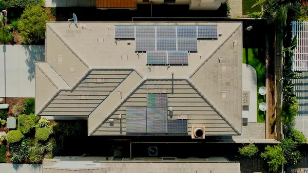 a view of balcony with wooden floor and potted plants