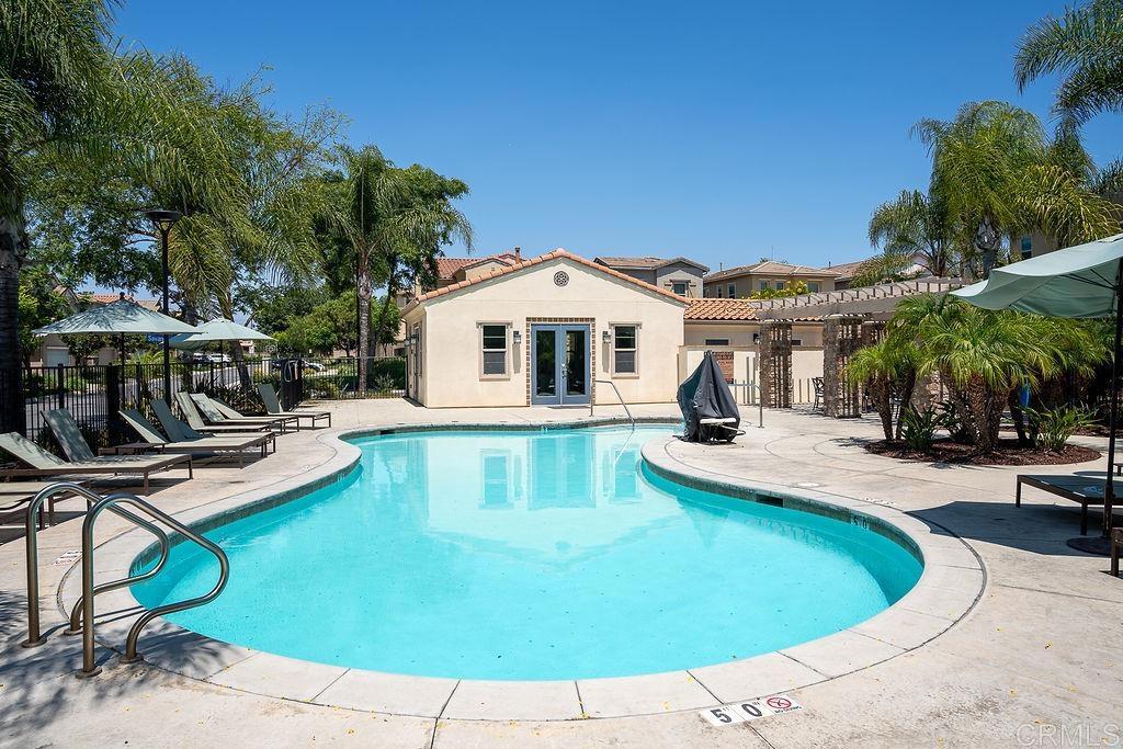 1132 Cherry Tree Lane Vista, CA 92084 - Photo 33 of 39 a view of a house with swimming pool and sitting area