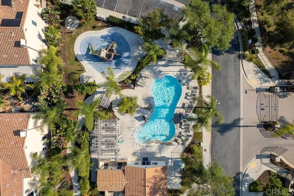 an aerial view of a house with a yard and garden