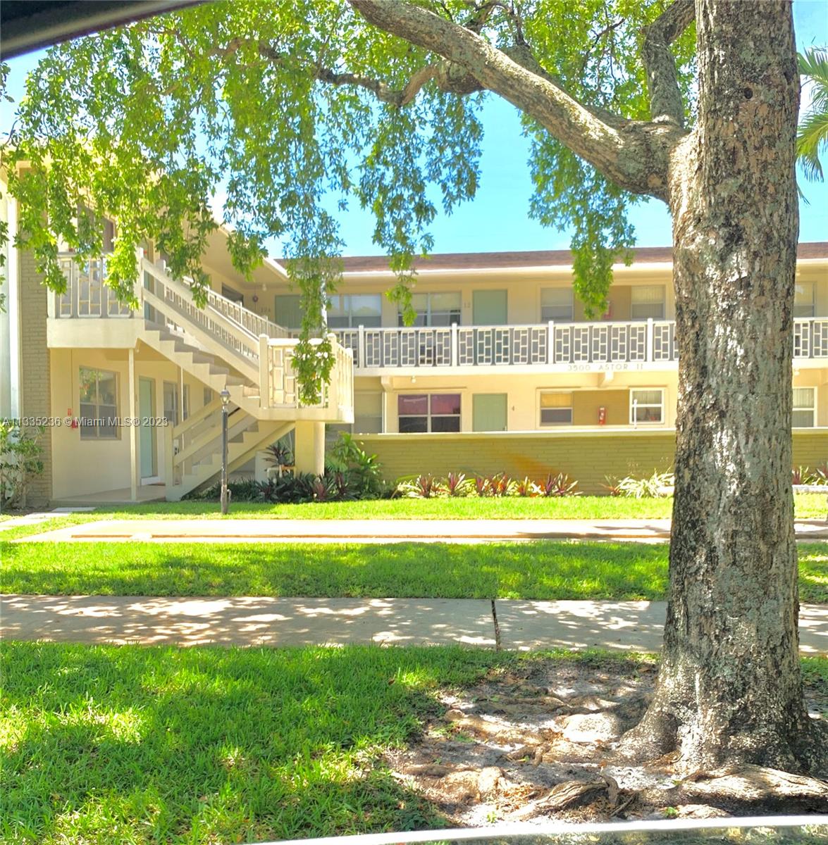 a front view of a house with a yard table and chairs