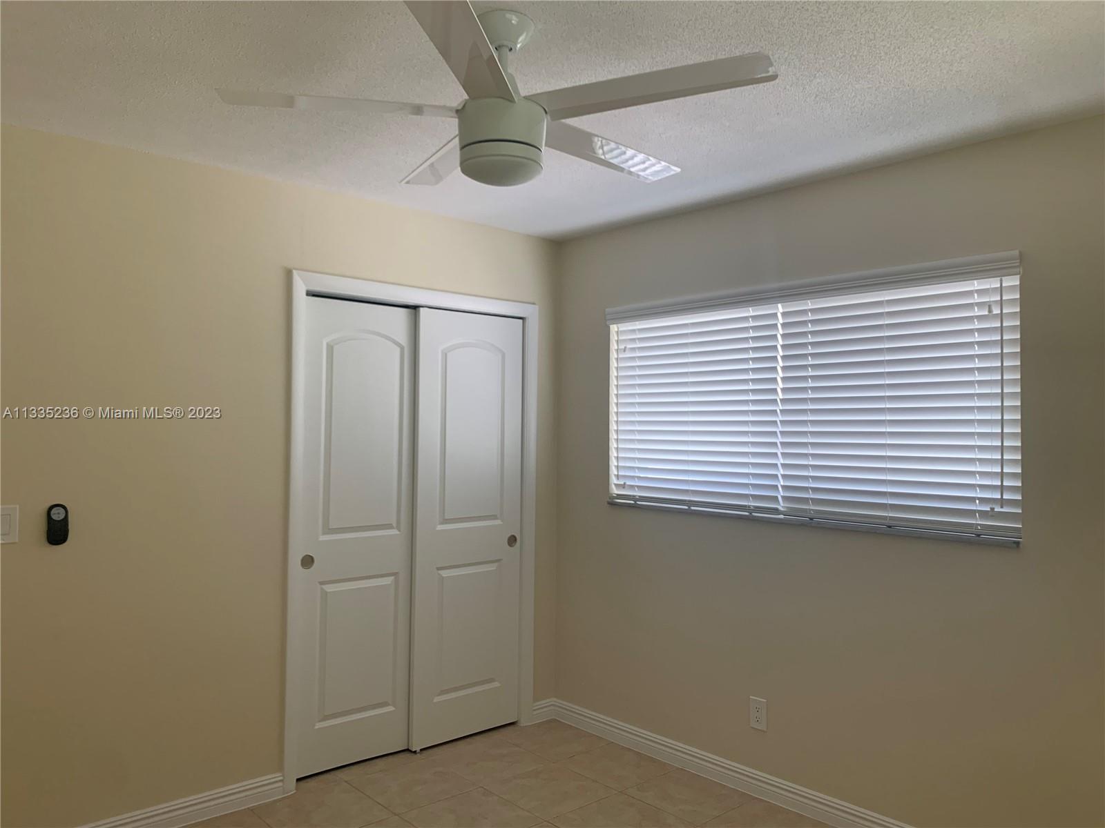 3500 Harrison Street, Unit 8 Hollywood, FL 33021 - Photo 14 of 59 an empty room with a window