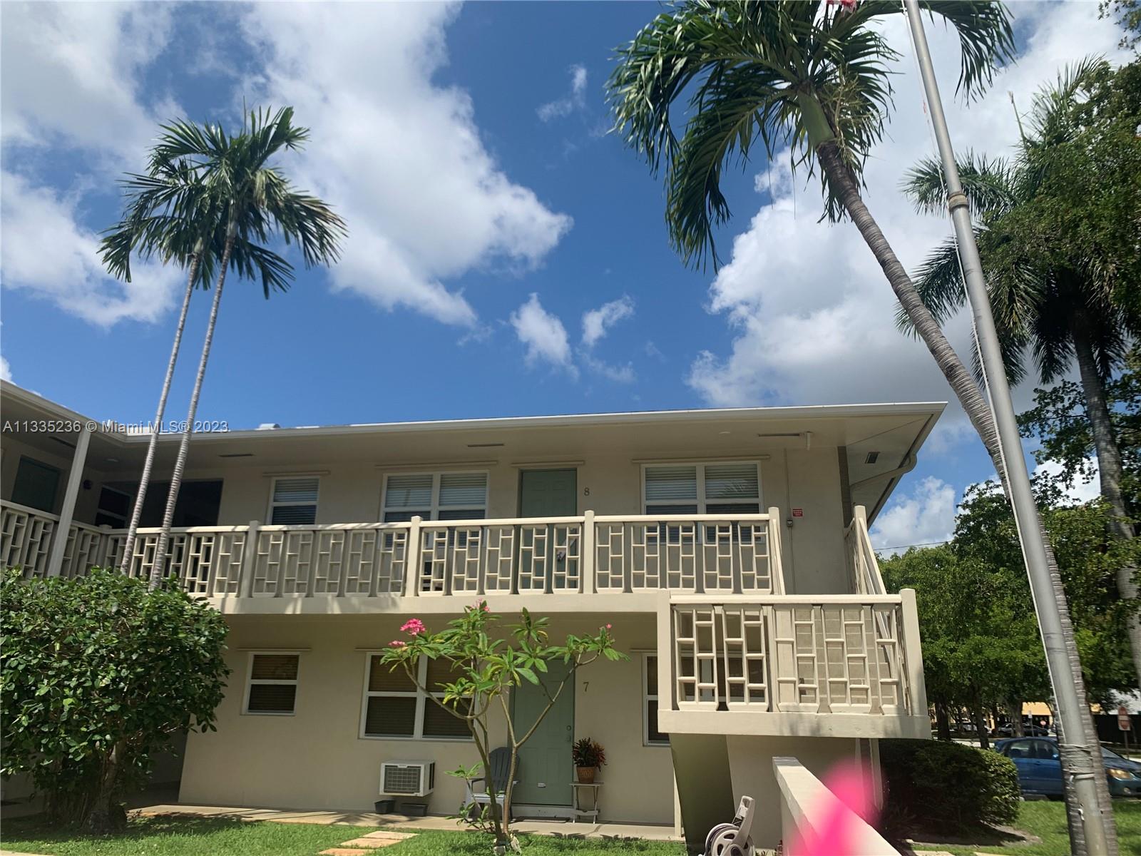 3500 Harrison Street, Unit 8 Hollywood, FL 33021 - Photo 25 of 59 a front view of a house with a yard