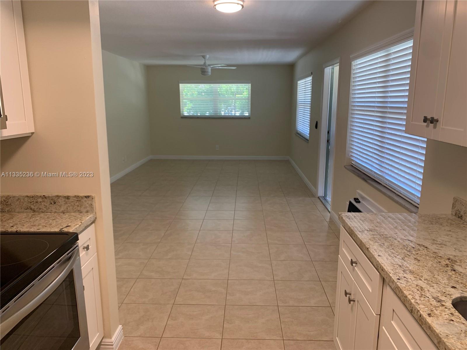 3500 Harrison Street, Unit 8 Hollywood, FL 33021 - Photo 36 of 59 an empty room with windows