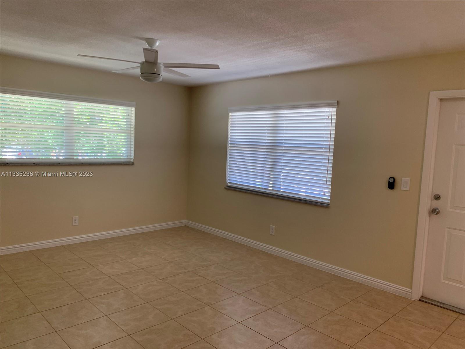 3500 Harrison Street, Unit 8 Hollywood, FL 33021 - Photo 43 of 59 an empty room with windows