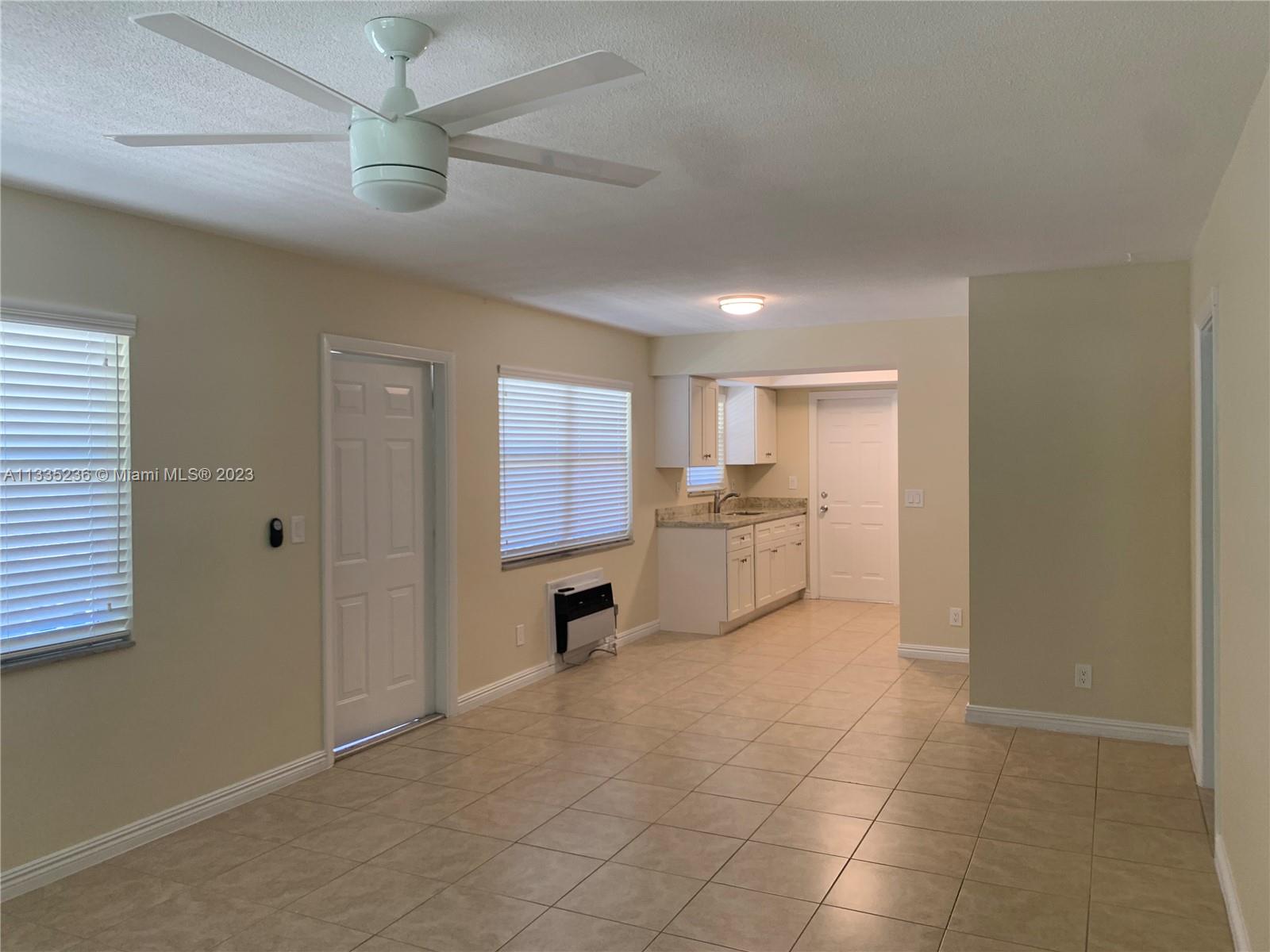 3500 Harrison Street, Unit 8 Hollywood, FL 33021 - Photo 44 of 59 a view of a kitchen with a sink and a refrigerator