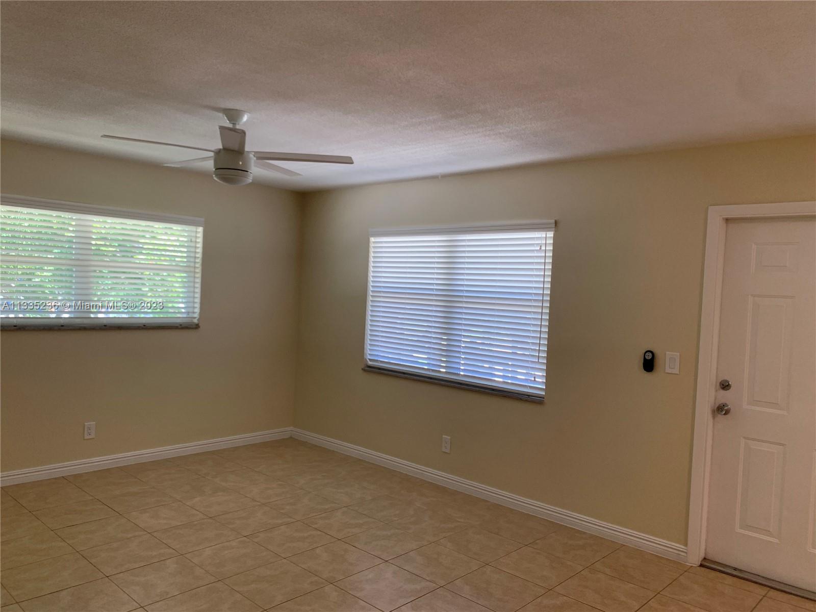 3500 Harrison Street, Unit 8 Hollywood, FL 33021 - Photo 45 of 59 a view of an empty room with a window