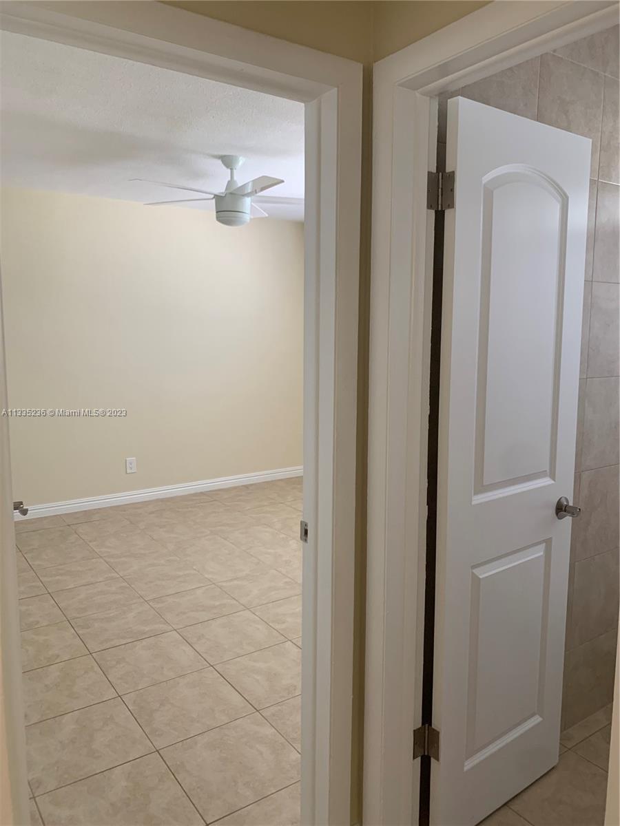 3500 Harrison Street, Unit 8 Hollywood, FL 33021 - Photo 48 of 59 a bathroom with a glass shower door