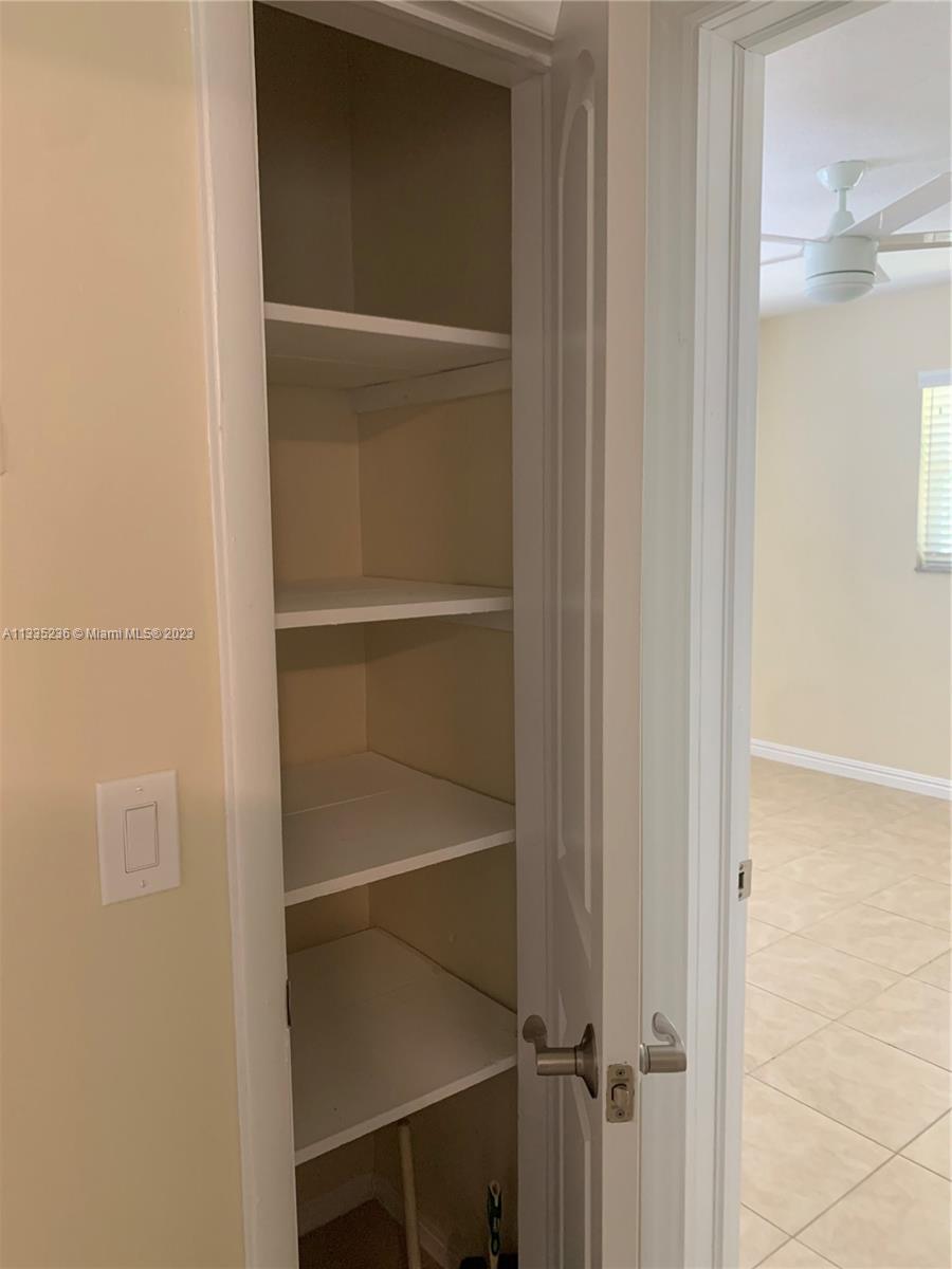 3500 Harrison Street, Unit 8 Hollywood, FL 33021 - Photo 50 of 59 a view of an empty walk in closet