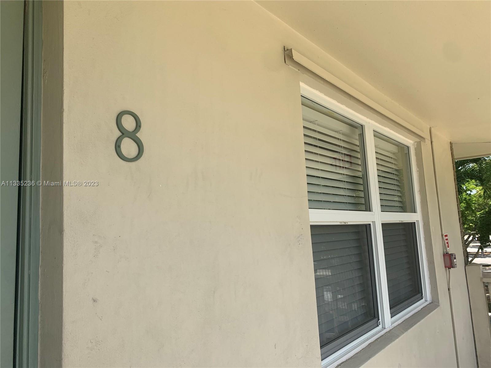 3500 Harrison Street, Unit 8 Hollywood, FL 33021 - Photo 5 of 59 a view of a door and a window