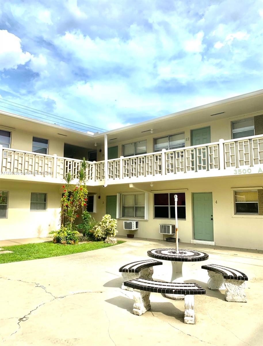 3500 Harrison Street, Unit 8 Hollywood, FL 33021 - Photo 59 of 59 a front view of a house with swimming pool