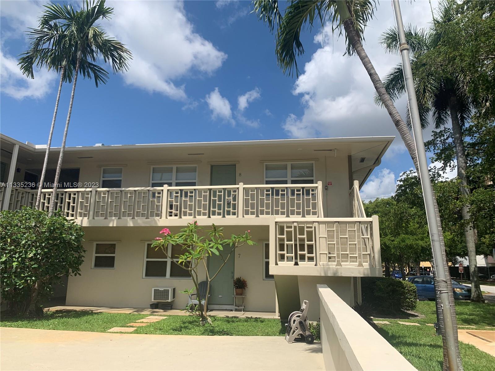 3500 Harrison Street, Unit 8 Hollywood, FL 33021 - Photo 6 of 59 a front view of house with yard and trees around
