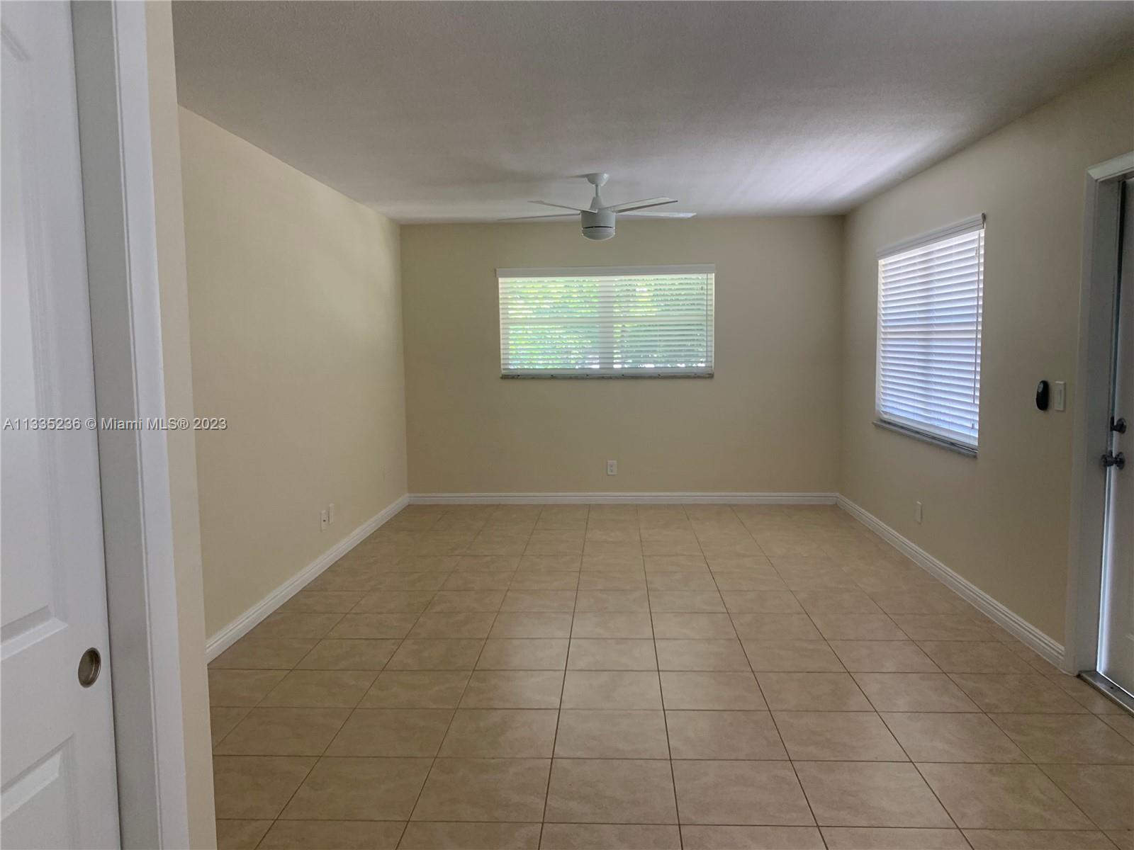 3500 Harrison Street, Unit 8 Hollywood, FL 33021 - Photo 8 of 59 a view of an empty room with a window