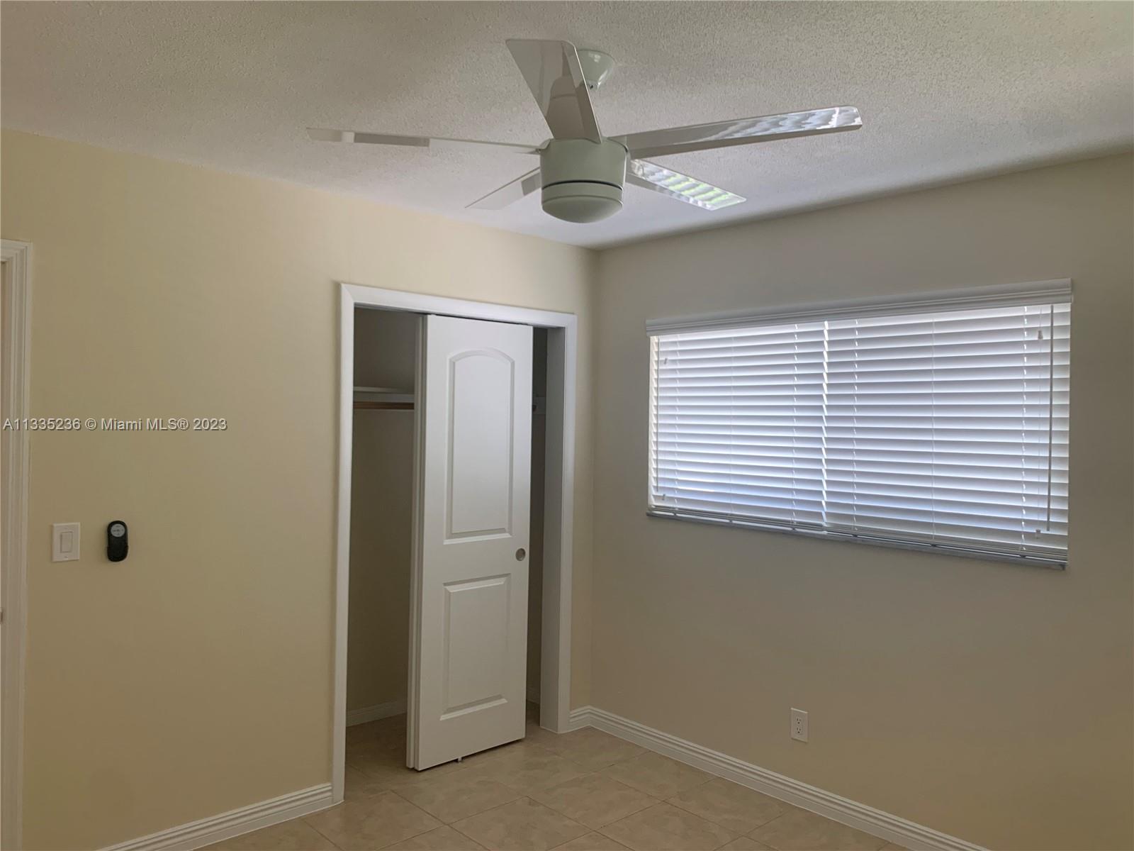 3500 Harrison Street, Unit 8 Hollywood, FL 33021 - Photo 10 of 59 a view of a livingroom with an entryway