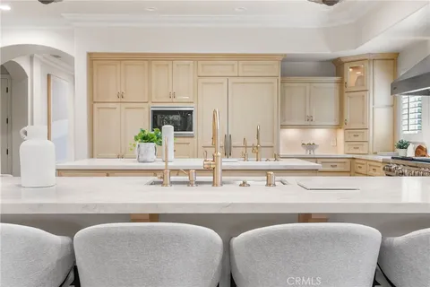a kitchen with stainless steel appliances granite countertop a sink and a cabinets