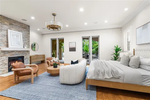 a bedroom with furniture and a fireplace