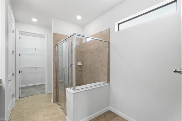 a bathroom with a shower and a sink