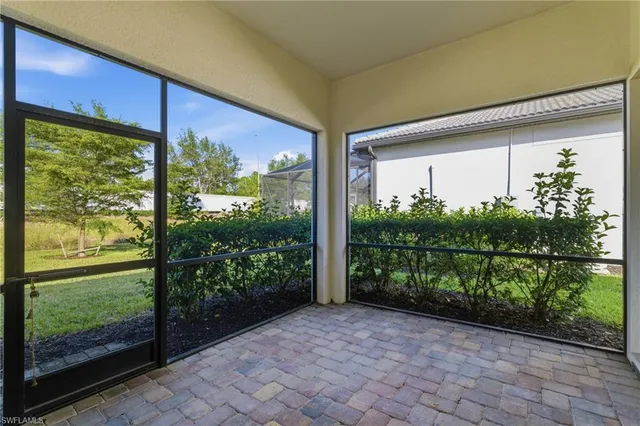 a view of a back yard from a room