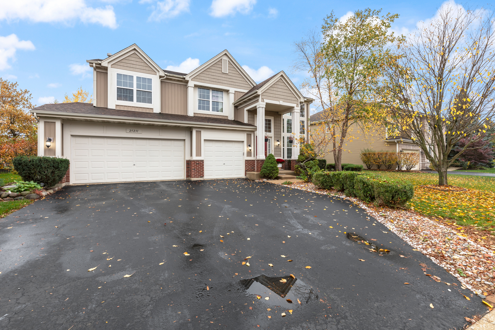 25231 Gettysburg Road Plainfield, IL 60544 - Photo 1 of 30 a front view of a house with a yard and garage
